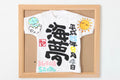 額付き命名ミニTシャツへびちゃん太陽